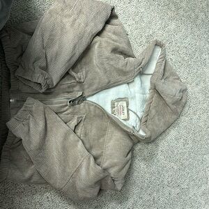 Tan winter coat with sherpa fur inside.